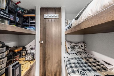 Discover a unique opportunity just steps from Cedar Mills Marina