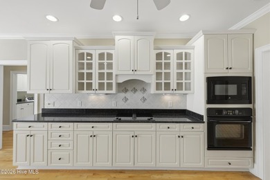 Stunning custom brick home located on the 18th hole of the - photo 22
