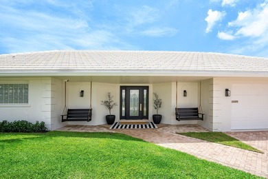 Welcome to this exceptional single-story waterfront residence in - photo 1