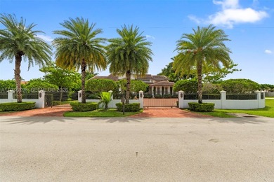 Stunning two-story estate in Miami on nearly an acre, featuring - photo 1