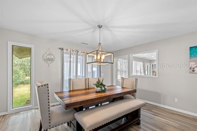 This beautifully updated residence offers laminate wood flooring - photo 12