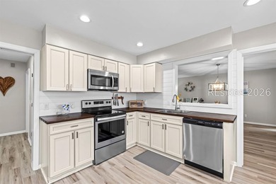 This beautifully updated residence offers laminate wood flooring - photo 17