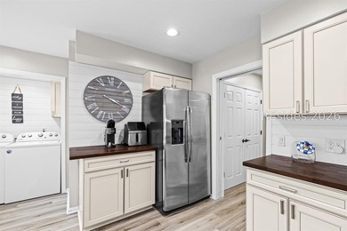 This beautifully updated residence offers laminate wood flooring - photo 19