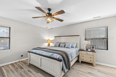 This beautifully updated residence offers laminate wood flooring - photo 22