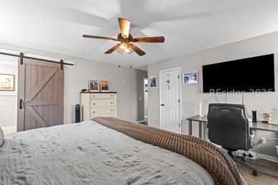 This beautifully updated residence offers laminate wood flooring - photo 23