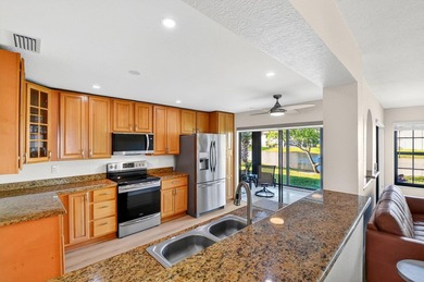 STUNNING LAKESIDE RENOVATION! 1st-floor condo offers expansive - photo 3