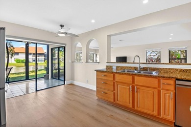 STUNNING LAKESIDE RENOVATION! 1st-floor condo offers expansive - photo 6