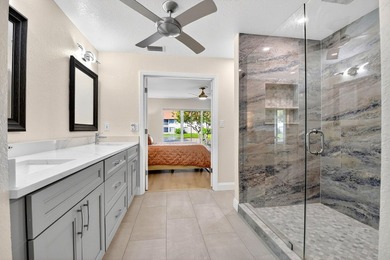 STUNNING LAKESIDE RENOVATION! 1st-floor condo offers expansive - photo 9