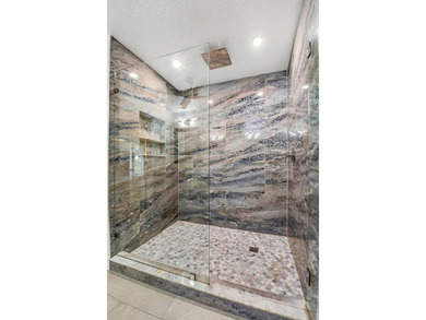 STUNNING LAKESIDE RENOVATION! 1st-floor condo offers expansive - photo 10