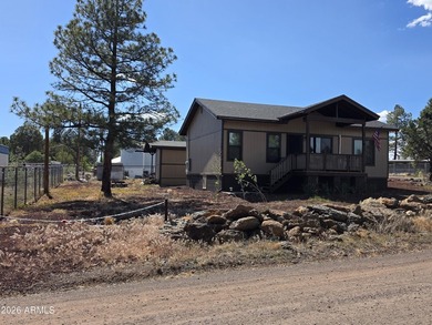 Nestled in the White Mountains of Arizona, Lakeside is a vibrant - photo 3