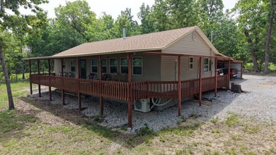 Tucked away in the beautiful Ozarks near Bull Shoals Lake, this - photo 1