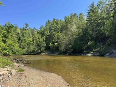 Nestled along the beautiful Rifle River, this charming - photo 2