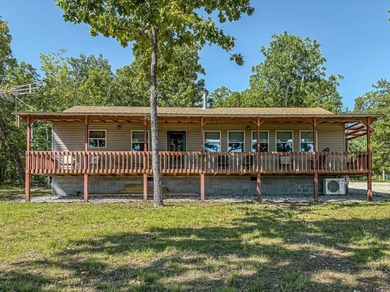 Tucked away in the beautiful Ozarks near Bull Shoals Lake, this - photo 3
