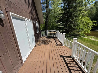 Nestled along the beautiful Rifle River, this charming - photo 3