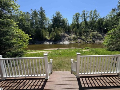 Nestled along the beautiful Rifle River, this charming - photo 4