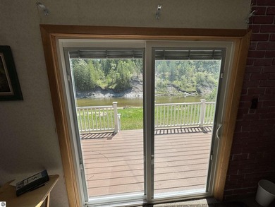 Nestled along the beautiful Rifle River, this charming - photo 10