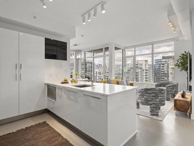 Perched on the coveted NW comer of the sub-penthouse level, this - photo 4