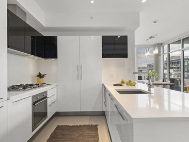 Perched on the coveted NW comer of the sub-penthouse level, this - photo 5