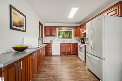Nestled on 99 feet of Van Ettan Lake frontage and surrounded by - photo 6