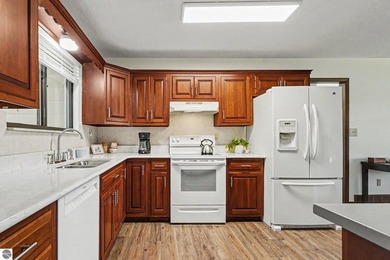 Nestled on 99 feet of Van Ettan Lake frontage and surrounded by - photo 7