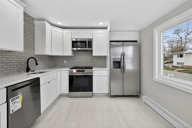 Beautifully renovated 4-bedroom Hi-Ranch offering exceptional - photo 11
