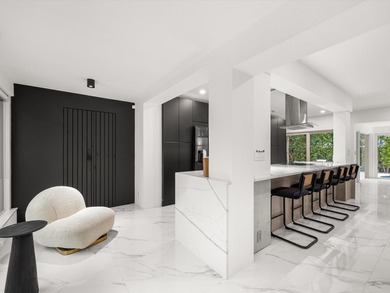 LUXURY updated 4 bedroom/3 bathroom SMART home in Coral Ridge - photo 9