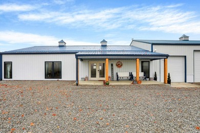 This exceptional 2-year-old barndominium offers modern country