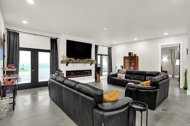 This exceptional 2-year-old barndominium offers modern country