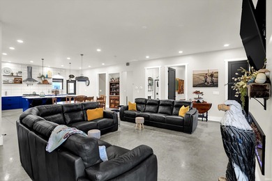 This exceptional 2-year-old barndominium offers modern country