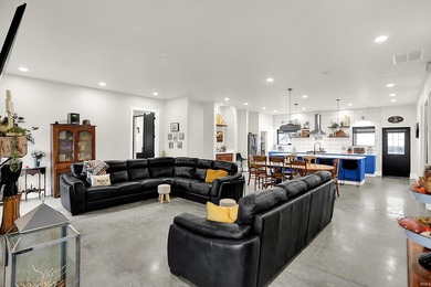 This exceptional 2-year-old barndominium offers modern country