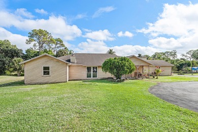(private lake, pond, creek) Home For Sale in The Acreage Florida