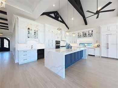 Located at 7394 Gathering Court within the exclusive gates of - photo 7