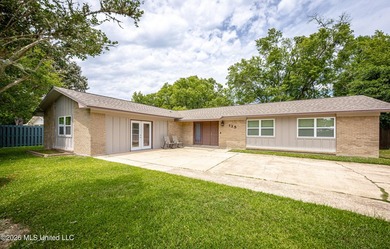 Located in Ocean Springs' desirable Golf Cart District, this - photo 1