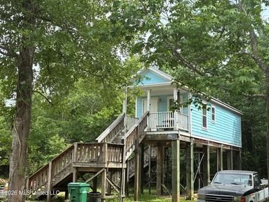 Charming cottage nestled on a spacious half-acre lot in the - photo 1