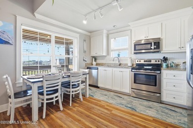 Waterfront living meets coastal charm in this beautifully - photo 12