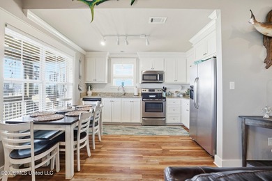 Waterfront living meets coastal charm in this beautifully - photo 13