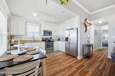 Waterfront living meets coastal charm in this beautifully - photo 14