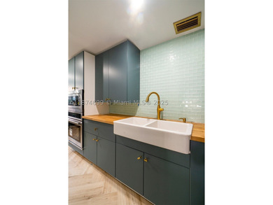 Exquisitely & completely renovated with no expense spared, this - photo 18