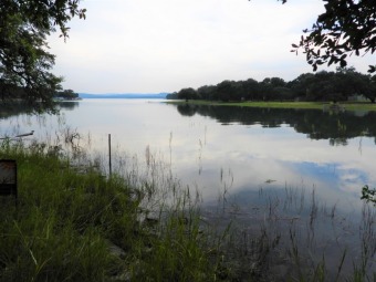 LOVELY Waterfront lot with approx 70ft on the water. 0.73 acres.  - Lake Lot For Sale in Lakehills, Texas