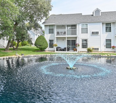 Main floor END UNIT Condo with picturesque western pond views - Lake Condo For Sale in Waterford, Wisconsin