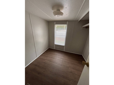 This 1980 2-bedroom 1-bathroom mobile home offers comfort - photo 2