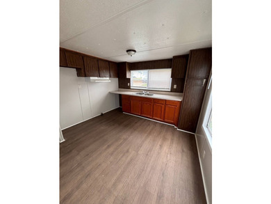 This 1980 2-bedroom 1-bathroom mobile home offers comfort - photo 3