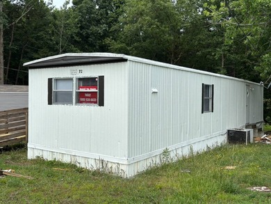 This 1980 2-bedroom 1-bathroom mobile home offers comfort - photo 6