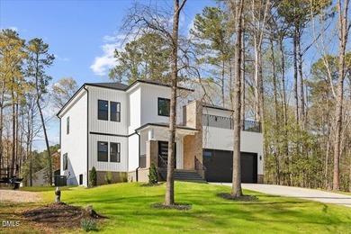 Stunning modern new construction in the gated lake community of - photo 2