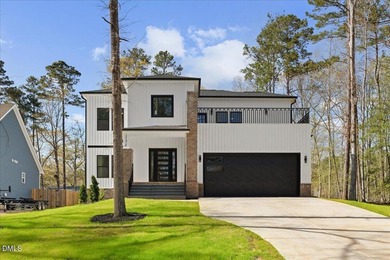 Stunning modern new construction in the gated lake community of - photo 3