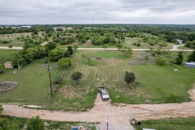 0.57-acre L-shaped lot located just south of Lake Brownwood. The - photo 3