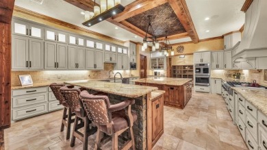 Welcome to 117 Hansma Way, a breathtaking custom ranch estate in