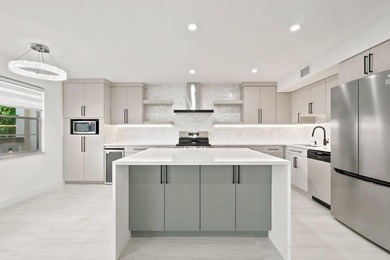 Welcome to this impeccably renovated 2-bedroom, 2-bath residence - photo 2