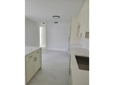 I am pleased to present this fully renovated, with new - photo 4