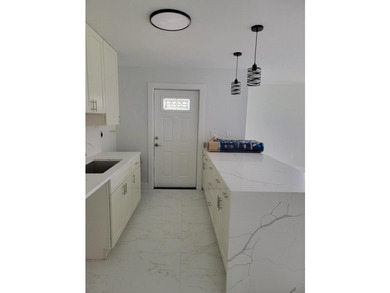 I am pleased to present this fully renovated, with new - photo 6